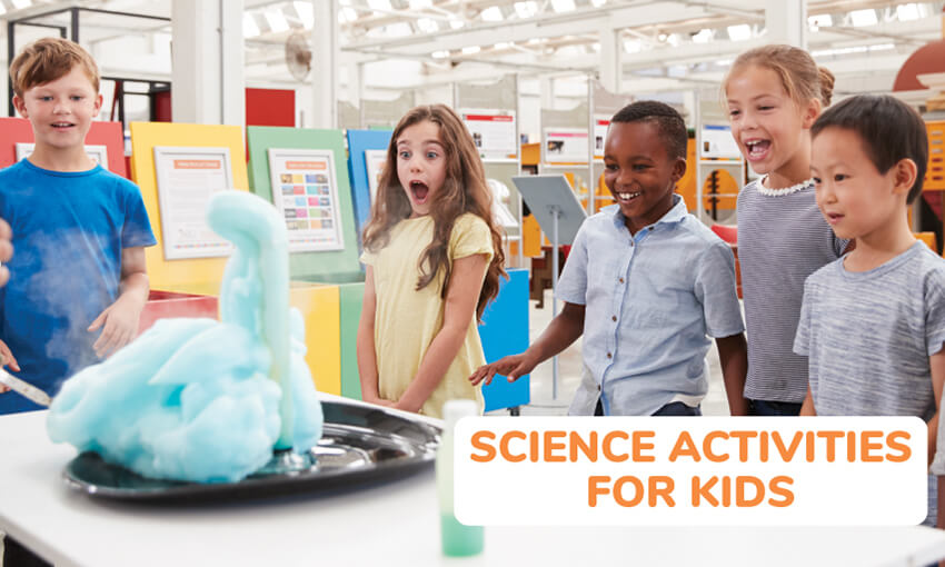 A group of kids gathered around a beaker on a tray. The beaker is overflowing with blue cotton candy like substance. Text reads science activities for kids. 
