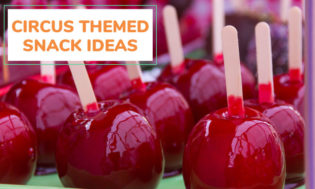 A picture of apples on a stick with some type of red syrup coating. Text reads circus themed snack ideas. 