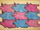 A picture of a tessellation art project, this one has several pigs in the art.