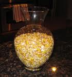 A large bowl filled with lots of popcorn kernels.