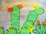 cactus art activity showing two cactuses with budding flowers. They are a brighter green color. 