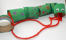An image of a green construction paper chain with a red string as the tongue. 