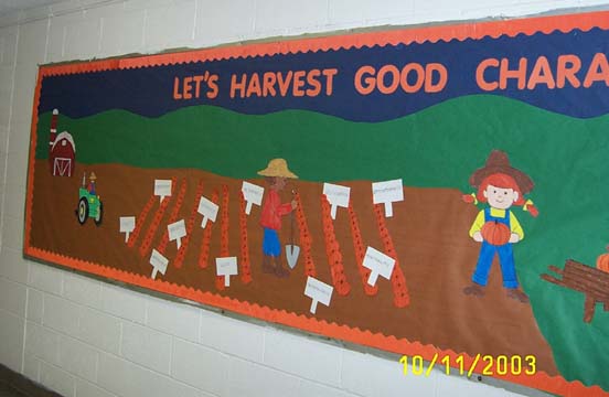 A bulletin board with a farmer and a field of crops. The heading of the bulletin board reads "Let's Harvest Good Character." 