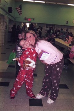 A picture of a mom and daughter in pajamas at a pajama school event. 