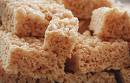 A picture of rice krispie treats stacked on top of each other. 