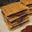 A picture of s'mores stacked on top of each other. Chocolate and graham crackers. 