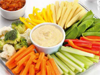 A vegetable tray with dip. 