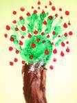 A cherry tree art project with the leaves and branches being a hand print in green paint. Red paint is dotted over the hand to represent the cherries. 