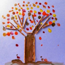 A picture of a toothpick tree. The toothpicks are used to make tree branches and the trunk of the tree. There is red, yellow, and brown paint to represent the leaves. 