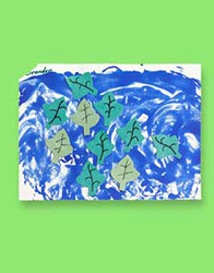 This leaf themed art project is "leafs blowing in the wind." The leaves are dark and light green with leaf veins. 