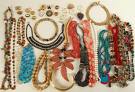 An image of jewelry. Lots of necklaces, bracelets, and earrings. 