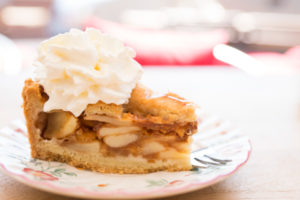 piece of apple pie with whipped cream