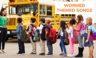 A picture of kids lined up in front of a teacher with a school bus in the background. The text reads worm themed songs for kids. 