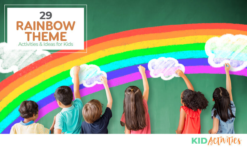 A picture of 6 children reaching up appearing to color the bright rainbow on the wall with clouds in front of the rainbow. Text reads "29 rainbow themed games and activities for kids."