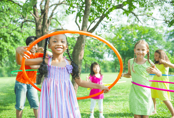kids playing hula hoops contest
