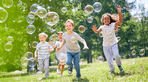 soap bubbles with kids running around