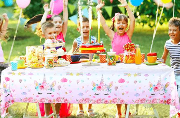 table setting with unicorn printed tablecloths