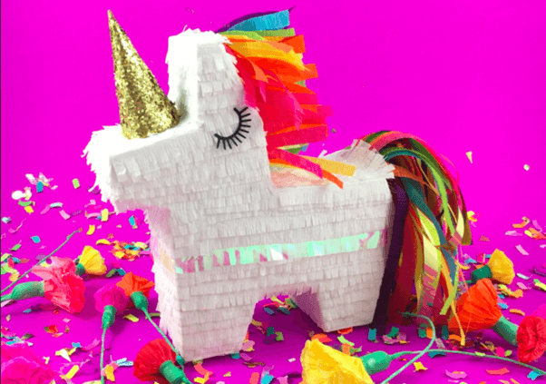 unicorn piñata filled with candies