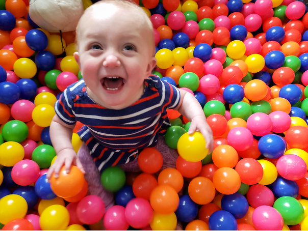 a baby inside a ball pit