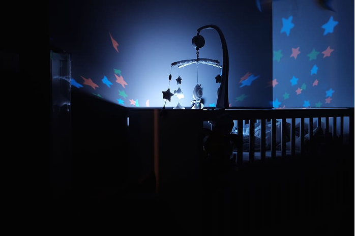 dark kid bedroom with light from a flashlight