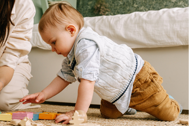 baby trying to crawl on the floor