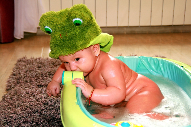 baby inside a tiny bathtub 