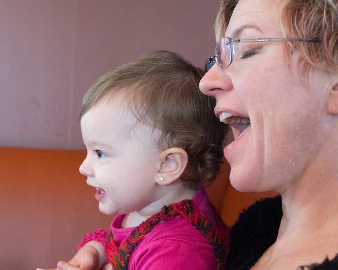 mom singing with baby